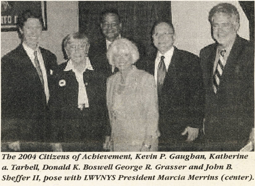 Photo shows Taffy Tarball and other winners of the League's 2004 Citizens of Achievement award together with the then-League President